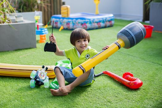 Boy with inflatable microphone at a children's birthday party.