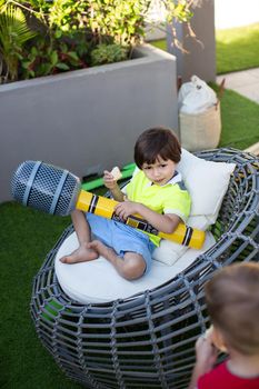 Boy with inflatable microphone at a children's birthday party.