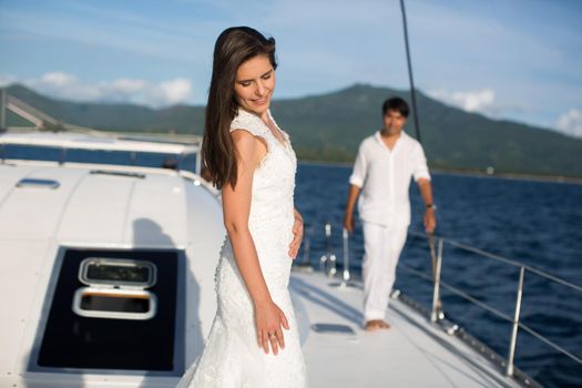 Just married couple on yacht. Happy bride and groom