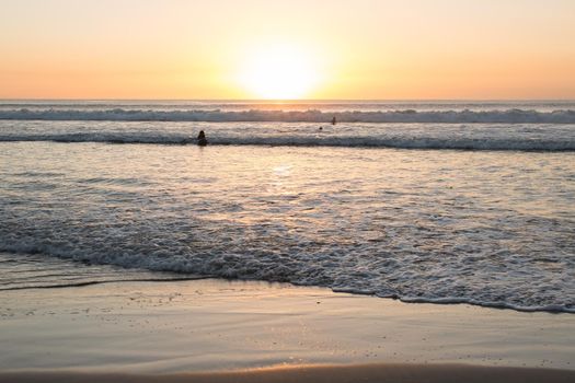 Sandy beach of the Indian Ocean at sunset.