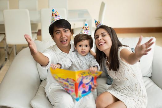 Portrait of a parents celebrating little their son's birthday