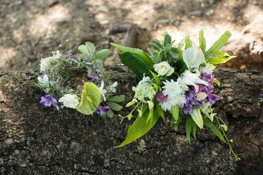 wedding bouquet and wreath on a wooden table