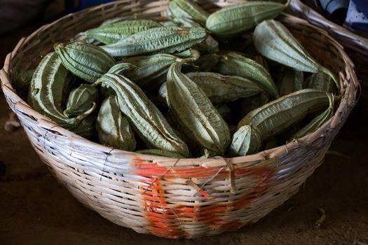 Winged beans in the wicker basket in the Indian market in Mauritius.