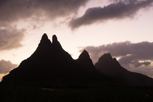 Silhouette of a mountain range at sunset.