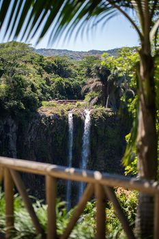 Waterfall flows into the crater of the volcano in Mauritius. National Park Chamarel.