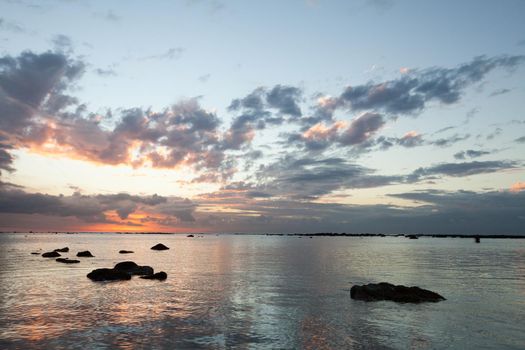 Aerial panoramic view of sunset over ocean.