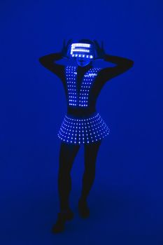 Disco dancer moves in UV ultraviolet suit