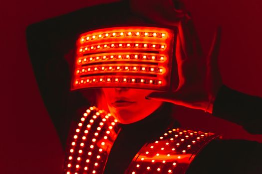 Disco dancer moves in UV ultraviolet suit.