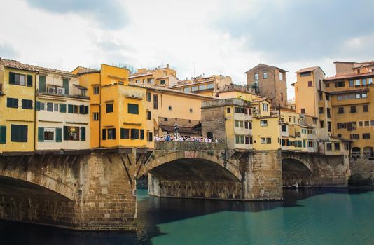 Ponte Vecchio bridge on a sunny summers' day in Florence, Italy. High quality photo.