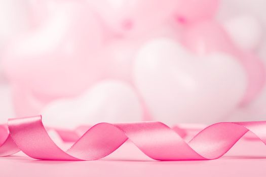 Valentine day background with pink curly satin ribbon and many balloons with copy space for text