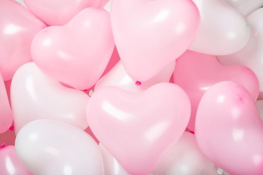Happy valentines day greetings many heart shaped pink and white balloons background