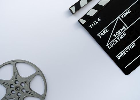 Close up of a vintage clapboard with 8mm filmstrip on white background.