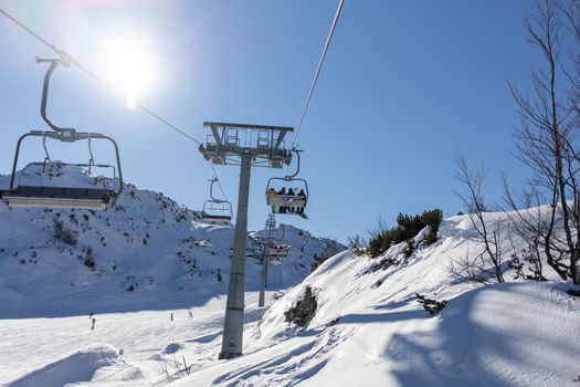 chairlift at mountain ski resort on sunny day. High quality photo