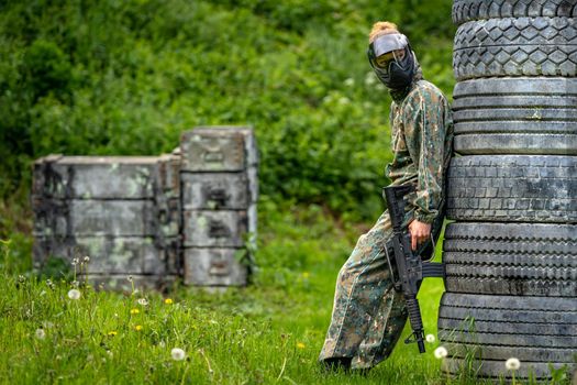 woman in action while playing paintball.