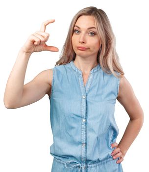 Happy smiling beautiful young woman showing the small size isolated on white background