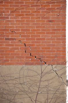 Red Brick Wall and Foundation with Large Crack and crumbling mortar. High quality photo