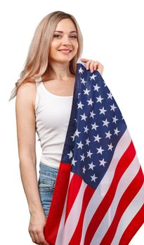 Portrait of a young smiling woman holding USA flag isolated on white background