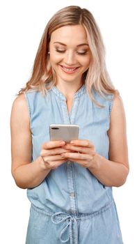 Portrait of a smiling casual woman holding smartphone over white background, close up