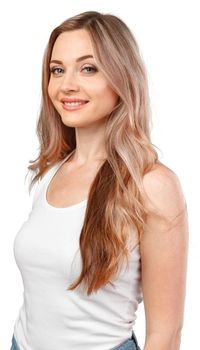 Portrait of young beautiful girl smiling looking at camera over white background, close up