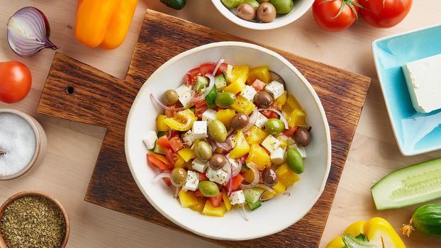Banner Greek village salad horiatiki with feta cheese, olives, pepper, tomatoes, cucumber and red onion, vegeterian mediterranean food, low calories dieting meal, copy space