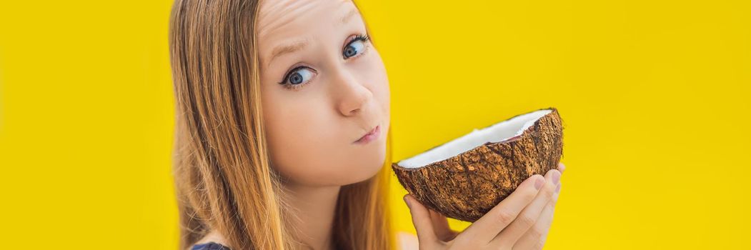 Young woman doing oil pulling over yellow background. BANNER, LONG FORMAT