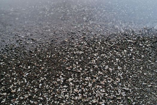 Ocean Water Meeting Pebbled Beach BAckground Texture from Ruckle Park on Salt Spring Island. High quality photo