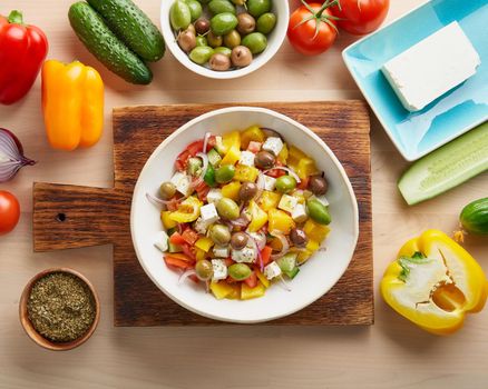 Greek village salad horiatiki with feta cheese, olives, cherry tomato, cucumber and red onion, vegeterian mediterranean food, low calories dieting meal, copy space