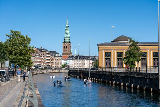 Copenhagen, Denmark - September 02, 2021: Tourist boats in Holmen channel on a sunny day.