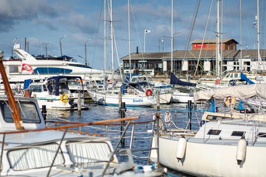 Hundested, Denmark - October 16, 2021: Sailboats anchored at the small local harbour.