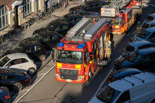 Copenhagen, Denmark - September 01, 2021: High angle view of fire trucks parked in a street.