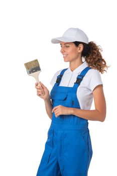 Female house painter with paint brush isolated on white background, full length portrait