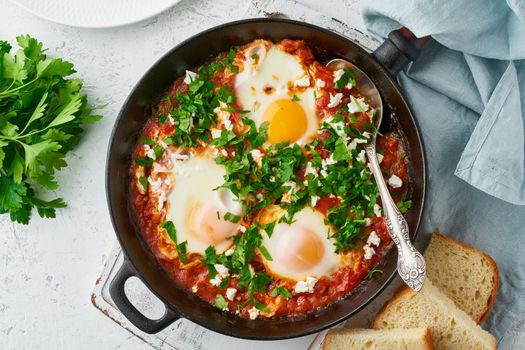 Shakshouka, eggs poached in sauce of tomatoes, olive oil, peppers, onion and garlic, Mediterranean cuisine. Keto meal, FODMAP recipe, low carb