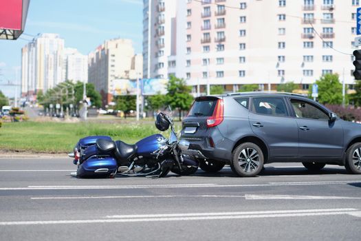 Portrait of traffic accident between electric bicycle and car, motorbike fell on asphalt, eyewitness man. Bike crashed into auto. Highway, accident concept