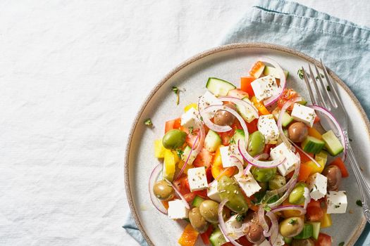 Part of Greek village salad horiatiki with feta cheese and vegetables, vegeterian mediterranean food, low calories dieting meal. Copy space