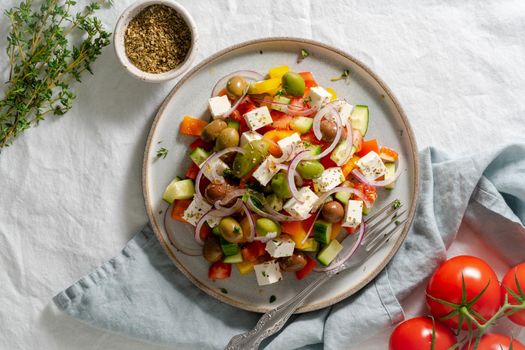 Greek village salad horiatiki with feta cheese and vegetables, vegeterian mediterranean food, low calories dieting meal, top view