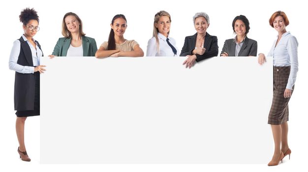 Group of business women in formal wear with long blank banner for your advertising or text isolated on white background full length portrait