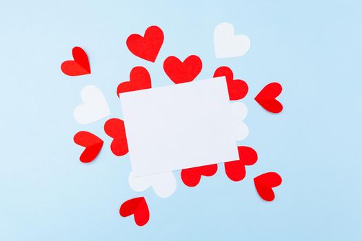 Valentine's Day. Gifts, hearts on blue background. Concept of love, affection. Holiday card.