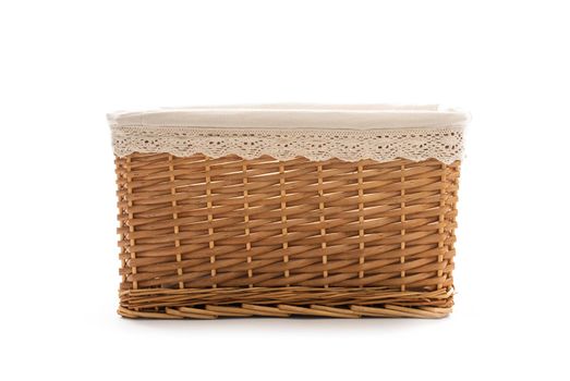 wicker basket for clothes on a white background