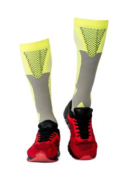 yellow gaiters in red sneakers isolated on white