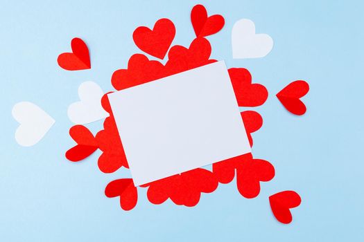 Valentine's Day. Gifts, hearts on blue background. Concept of love, affection. Holiday card.