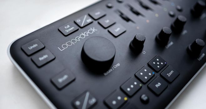 Kyiv, Ukraine - 28 December 2021: Loupedeck Photo Editing Console and Lightroom Keyboard for Adobe Lightroom