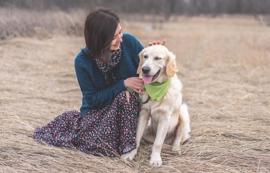 Active dog with pretty woman outside