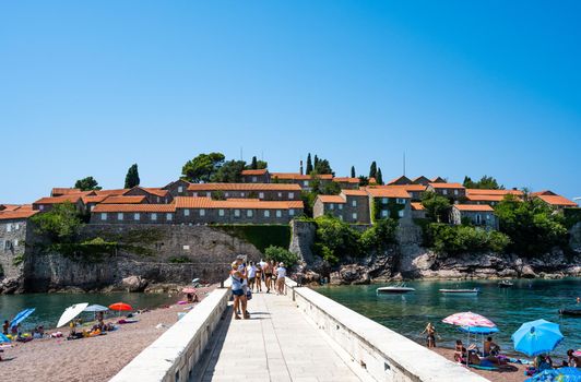 Budva, Montenegro - 27 July 2021: Sveti Stefan island in Budva, Montenegro with view on beaches in sunny day