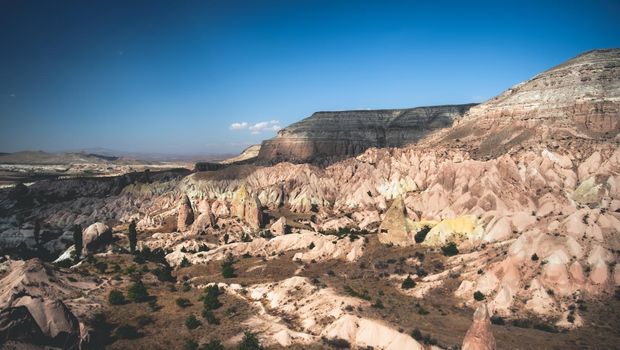 Panoramic view of mountains under sun in Cappadocia, Turkey