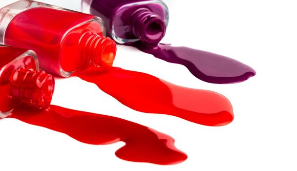 Bright colours of nail polish leaking from bottles