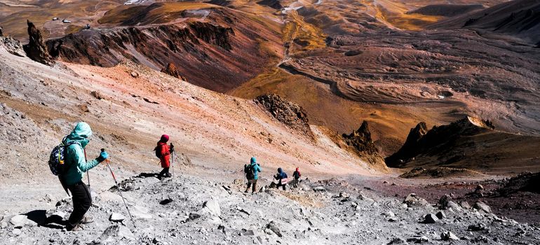 Tourists trekking on Erciac volcano in Turkey, view from top
