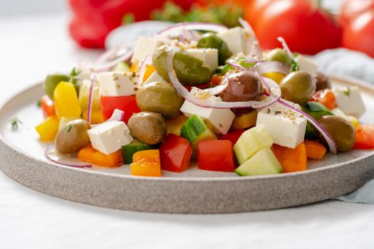 Greek village salad horiatiki with feta cheese and vegetables, vegeterian mediterranean food, low calories dieting meal, side view, close up