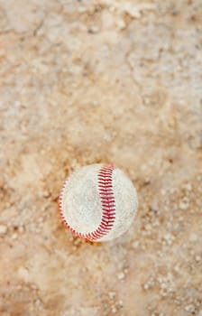 Still life shot of a baseball ball on the pitch outdoors during the day