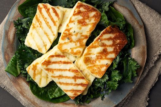 Keto, ketogenic diet. Cyprus fried halloumi cheese with healthy green salad. Lchf, pegan, fodmap, paleo, scd. Balanced food, a greek clean eating recipe, close up
