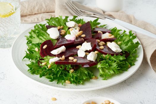 salad with beet, curd, feta, ricotta and pine nuts, lettuce. Healthy keto ketogenic dash diet, side view